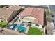 Aerial view of the home's backyard, highlighting the pool, patio, and landscaped lawn at 5779 S Penrose Dr, Gilbert, AZ 85298