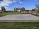 A beautiful shot of a pristine, outdoor basketball court with playground and neighborhood in background at 5779 S Penrose Dr, Gilbert, AZ 85298