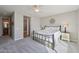 Inviting bedroom featuring neutral walls, comfy carpet, and an attached bathroom entrance at 5779 S Penrose Dr, Gilbert, AZ 85298