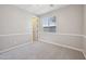 Cozy bedroom with a carpeted floor and bright window at 5779 S Penrose Dr, Gilbert, AZ 85298