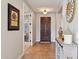 Inviting foyer features a solid wood door, tile flooring, and decorative accents at 5779 S Penrose Dr, Gilbert, AZ 85298