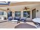 Covered patio with ceiling fans and outdoor seating at 5779 S Penrose Dr, Gilbert, AZ 85298