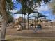 Community playground with slides and shade covers offers outdoor fun at 5779 S Penrose Dr, Gilbert, AZ 85298