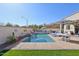 Backyard oasis with private pool, lounge chairs, and umbrellas at 5779 S Penrose Dr, Gilbert, AZ 85298