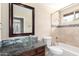 Bathroom featuring glass sink and framed mirror over vanity at 6533 E Beverly Ln, Scottsdale, AZ 85254