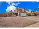 Attractive two-story house showcasing a neutral color palette, a two car garage and gravel landscaping at 6533 E Beverly Ln, Scottsdale, AZ 85254