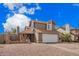 Attractive two-story house showcasing a neutral color palette, a two car garage and gravel landscaping at 6533 E Beverly Ln, Scottsdale, AZ 85254