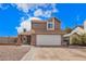 Charming two-story home featuring a two-car garage and desert landscaping for low maintenance at 6533 E Beverly Ln, Scottsdale, AZ 85254