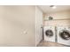 Laundry room with tile floor and white washer and dryer at 6533 E Beverly Ln, Scottsdale, AZ 85254