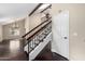 Bright, open-concept living area with high ceilings, wood floors, and a staircase leading upstairs at 6533 E Beverly Ln, Scottsdale, AZ 85254