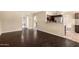 Open-concept living room featuring dark hardwood floors and arched entryways for a modern, inviting space at 6533 E Beverly Ln, Scottsdale, AZ 85254