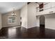 Open living room area with wood flooring, high ceilings, lots of natural light, and second story walkway at 6533 E Beverly Ln, Scottsdale, AZ 85254