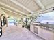 Covered back patio with a built-in grill and bar area, perfect for outdoor dining and relaxation by the pool at 6841 N 3Rd Pl, Phoenix, AZ 85012