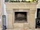 A stone fireplace with decorative garland on the mantle at 6841 N 3Rd Pl, Phoenix, AZ 85012