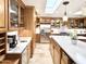 Well-lit kitchen featuring stone floors, stainless steel appliances, and a cozy breakfast bar at 6841 N 3Rd Pl, Phoenix, AZ 85012