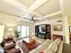 Spacious living room with coffered ceilings, plush seating, and a decorative fireplace beneath a TV at 6841 N 3Rd Pl, Phoenix, AZ 85012