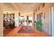 Stunning foyer showcasing the home's open floor plan, terracotta tile, and custom built-ins at 8154 E Tecolote Cir, Scottsdale, AZ 85266