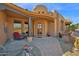 A close up of the home's charming front porch with seating at 8154 E Tecolote Cir, Scottsdale, AZ 85266