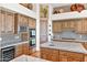 This kitchen features stainless steel appliances, a wine cooler, oven, and beautiful marble countertops at 8154 E Tecolote Cir, Scottsdale, AZ 85266