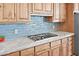 Close up on the spacious kitchen featuring light wood cabinets, and blue tiled backsplash at 8154 E Tecolote Cir, Scottsdale, AZ 85266