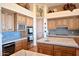 Gourmet kitchen with custom cabinets, tile backsplash, large island, and stainless steel appliances at 8154 E Tecolote Cir, Scottsdale, AZ 85266
