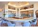 Spacious kitchen with stainless steel appliances, marble countertops, and seating for five at 8154 E Tecolote Cir, Scottsdale, AZ 85266