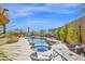 A luxurious pool and spa with outdoor seating and beautiful landscaping at 8154 E Tecolote Cir, Scottsdale, AZ 85266