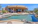 A stunning backyard features a sparkling pool and a built-in spa at 8154 E Tecolote Cir, Scottsdale, AZ 85266