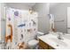 Bathroom with a shower tub, featuring a colorful pattern shower curtain at 891 E Windsor Dr, Gilbert, AZ 85296