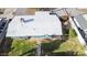 Aerial view of roof and backyard showing grass and additional small storage buildings at 1009 E Bethany Home Rd, Phoenix, AZ 85014