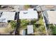 Aerial shot of home featuring a white roof, fenced yard, and detached storage building at 1009 E Bethany Home Rd, Phoenix, AZ 85014