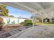 Backyard patio with hammock, garden, and covered seating area, perfect for relaxing outdoors at 1009 E Bethany Home Rd, Phoenix, AZ 85014