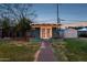 Backyard studio with a sidewalk, lush greenery, and a serene atmosphere at 1009 E Bethany Home Rd, Phoenix, AZ 85014