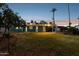 Backyard oasis featuring desert landscaping and mature trees, perfect for peaceful relaxation at 1009 E Bethany Home Rd, Phoenix, AZ 85014