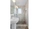 Bright bathroom features a glass shower and a white pedestal sink at 1009 E Bethany Home Rd, Phoenix, AZ 85014