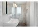 Bright bathroom features a glass shower and a white pedestal sink at 1009 E Bethany Home Rd, Phoenix, AZ 85014