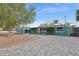 Charming teal home featuring a spacious, newly paved driveway and manicured landscaping at 1009 E Bethany Home Rd, Phoenix, AZ 85014