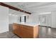 Kitchen island featuring a white countertop and custom wood cabinets at 1009 E Bethany Home Rd, Phoenix, AZ 85014