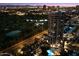 Night aerial view featuring a high-rise building, a golf course, and city lights at 1040 E Osborn Rd # 1801, Phoenix, AZ 85014