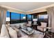 Comfortable living room with stylish seating, city views, and chic furnishings at 1040 E Osborn Rd # 1801, Phoenix, AZ 85014