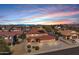 Stunning aerial view of a suburban neighborhood with a terracotta-roofed home, surrounded by desert landscaping at 10520 W Patrick Ln, Peoria, AZ 85383