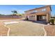 Backyard view features a concrete patio and low maintenance stone landscaping at 10520 W Patrick Ln, Peoria, AZ 85383