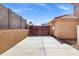 Long driveway leading to a gated backyard, with a tan stucco wall at 10520 W Patrick Ln, Peoria, AZ 85383