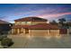 Charming two-story home with a terracotta roof, three-car garage, and well-maintained landscaping at 10520 W Patrick Ln, Peoria, AZ 85383