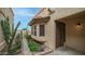 Exterior view of home featuring desert landscaping with cactus, succulents and rock accents at 10957 E Hope Dr, Scottsdale, AZ 85259