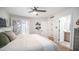 A relaxing main bedroom with hardwood floors and an en-suite bathroom view at 10957 E Hope Dr, Scottsdale, AZ 85259