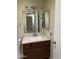 Bathroom featuring a granite countertop and mirrored medicine cabinet at 11001 W Tonada Dr, Sun City, AZ 85351