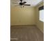 Bedroom featuring neutral carpeting, ceiling fan, and window with blinds at 11001 W Tonada Dr, Sun City, AZ 85351