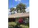 Home exterior showing tan paint and well-maintained landscaping with colorful bougainvillea at 11001 W Tonada Dr, Sun City, AZ 85351