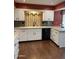 Updated kitchen featuring white cabinets, mosaic backsplash, and modern appliances at 11001 W Tonada Dr, Sun City, AZ 85351